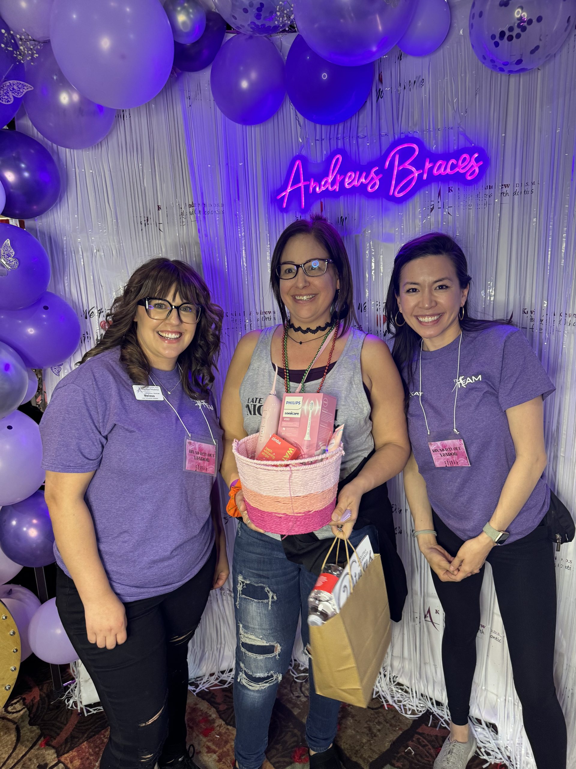 Melissa, Andrews Braces' lead assistant is standing with the winner of the dental health bakset, next to Dr. Kat, a Reno-Sparks orthodontist