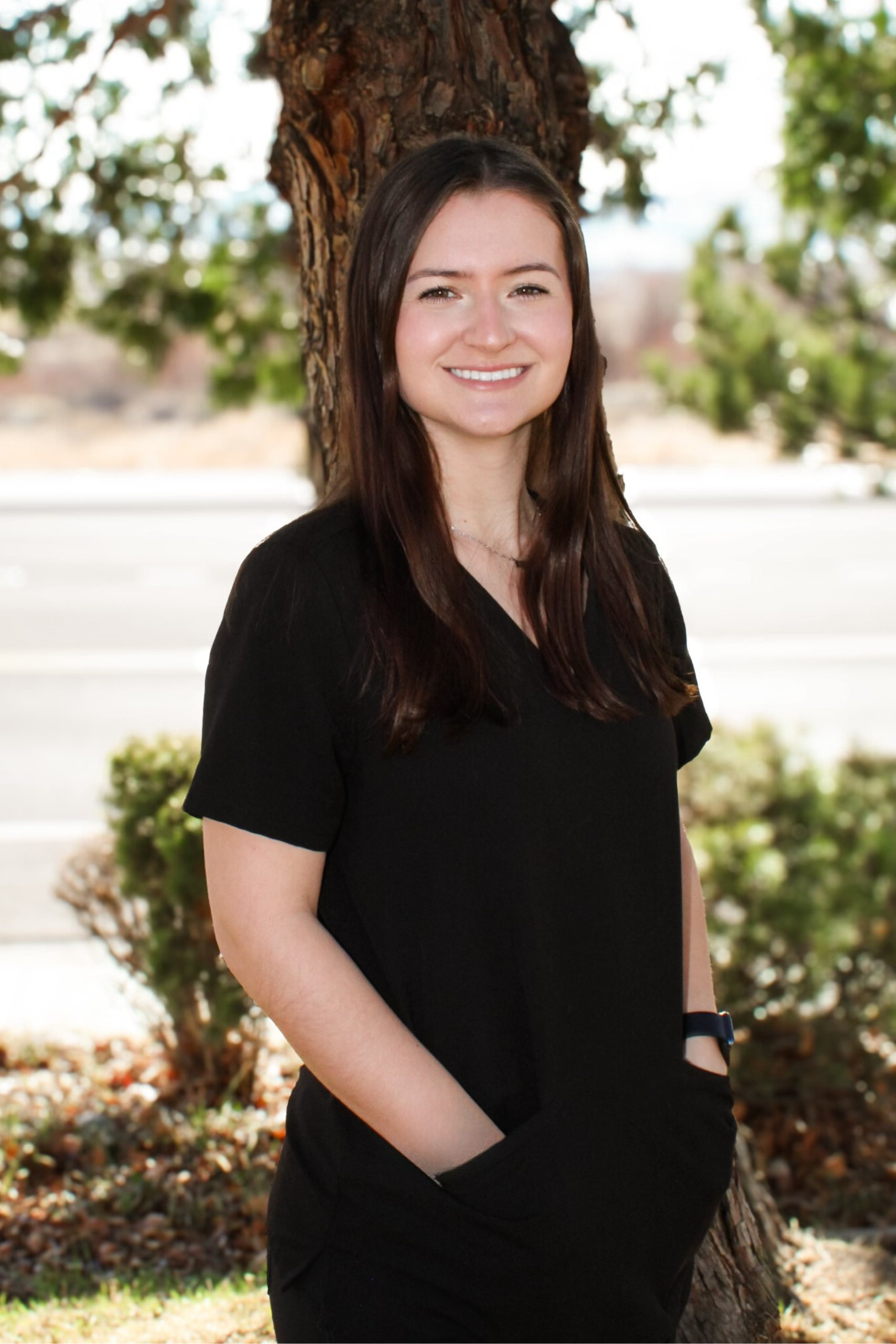 Natalie, the marketing coordinator is smiling for her headshot in Reno, Nevada at Andrews Braces